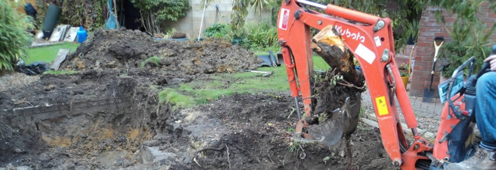 Pond construction garden man on digger